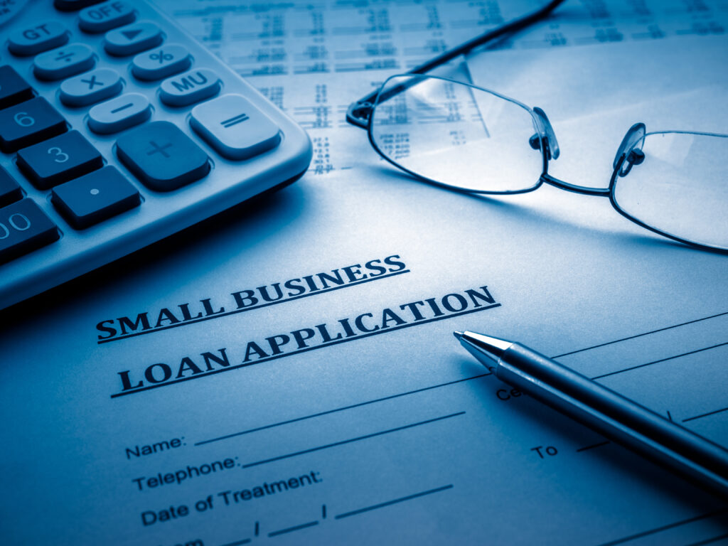 A small business loan application sitting on top of a table.